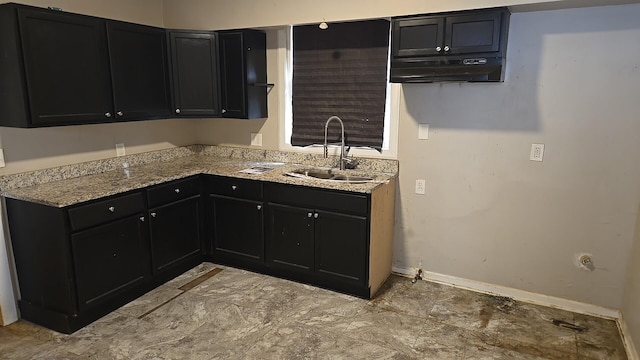 41 E 100th Pl, Chicago, IL 60628 - kitchen with range hood, dark cabinetry, and light stone countertops