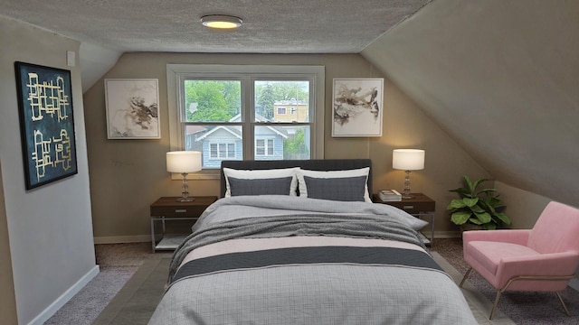 41 E 100th Pl, Chicago, IL 60628 - bedroom with vaulted ceiling, carpet floors, and a textured ceiling