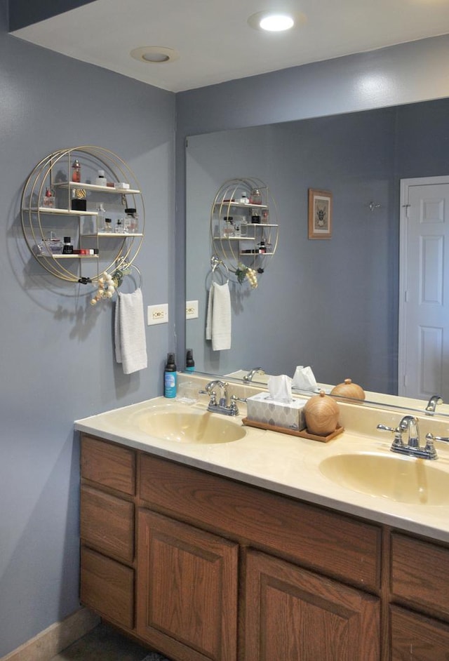 full bath featuring double vanity and a sink