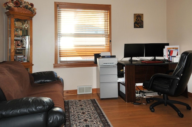 office space with light wood finished floors and visible vents