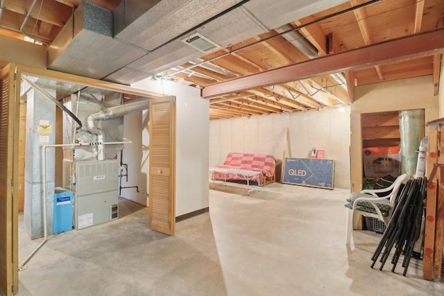 unfinished basement featuring visible vents