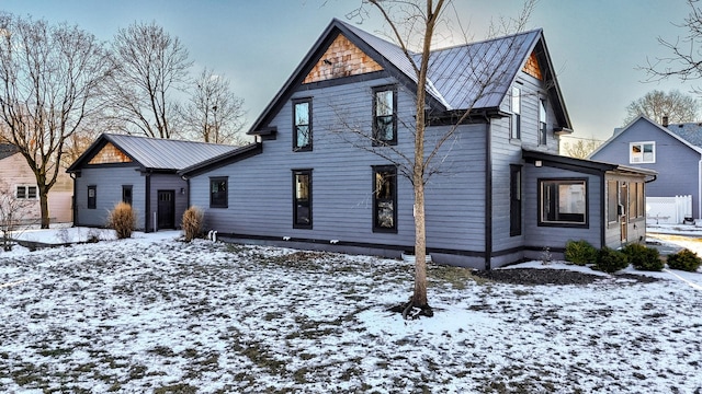 view of front of home featuring a standing seam roof and metal roof