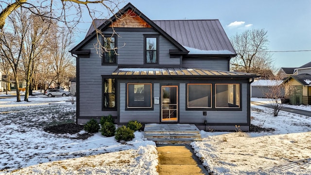 view of front of home featuring a standing seam roof and metal roof