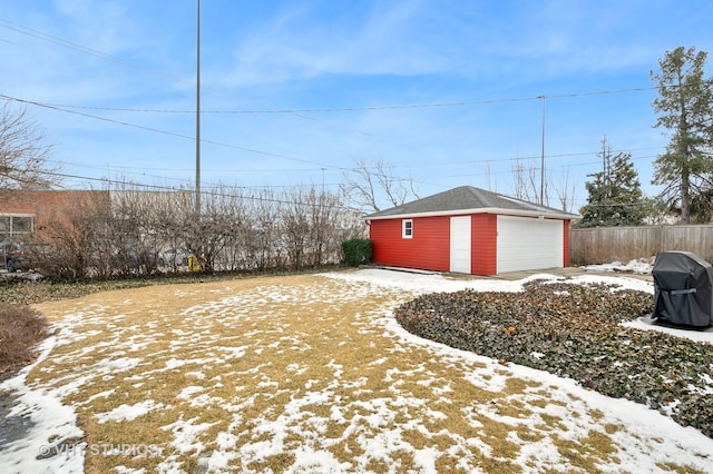 view of yard with a garage and an outdoor structure