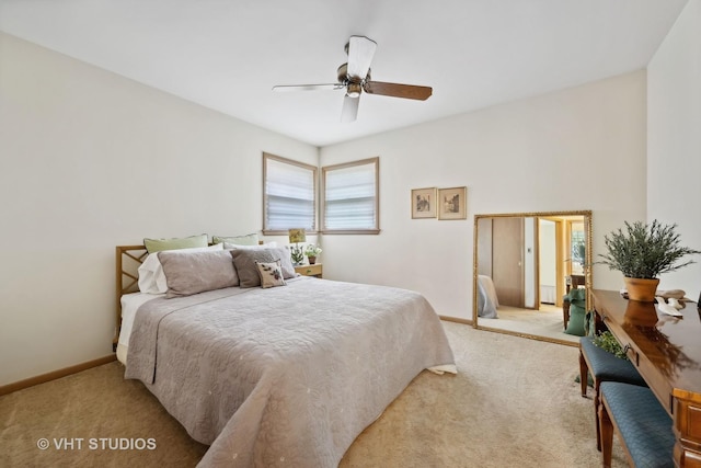 bedroom with light colored carpet, ceiling fan, and baseboards