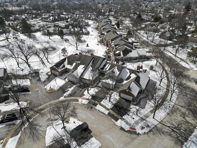 snowy aerial view featuring a residential view