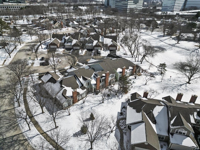 snowy aerial view featuring a residential view