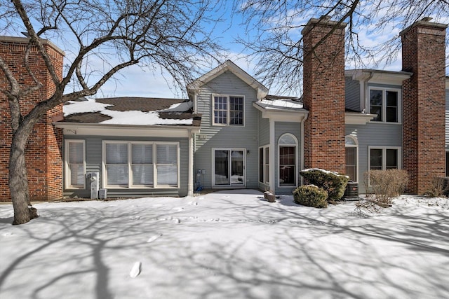 view of front of home featuring a chimney