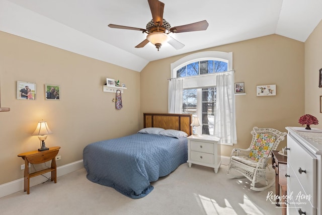 bedroom featuring lofted ceiling, baseboards, and light colored carpet