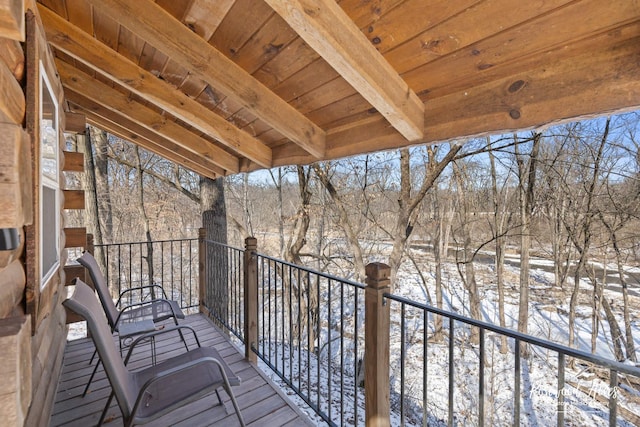 view of snow covered deck