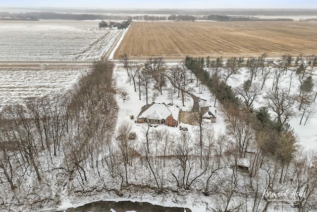 snowy aerial view featuring a rural view