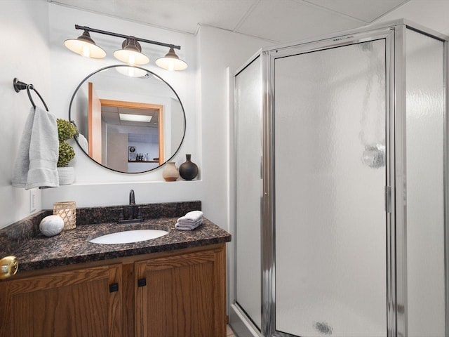 full bathroom with a stall shower and vanity