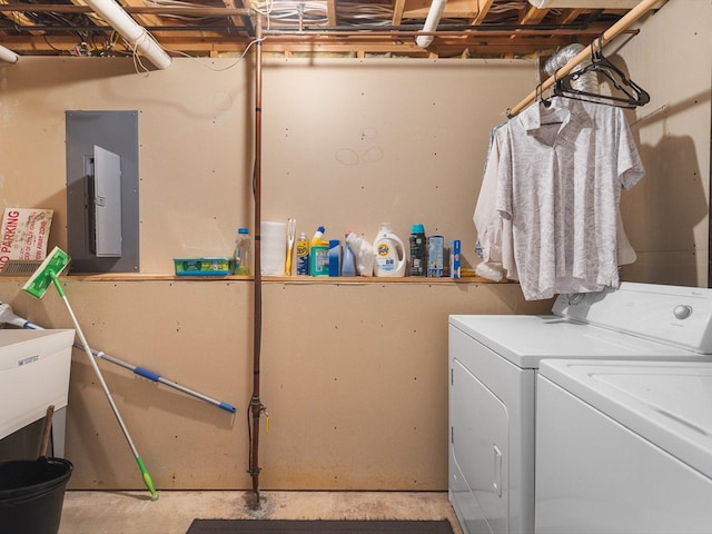 washroom featuring laundry area, independent washer and dryer, and electric panel