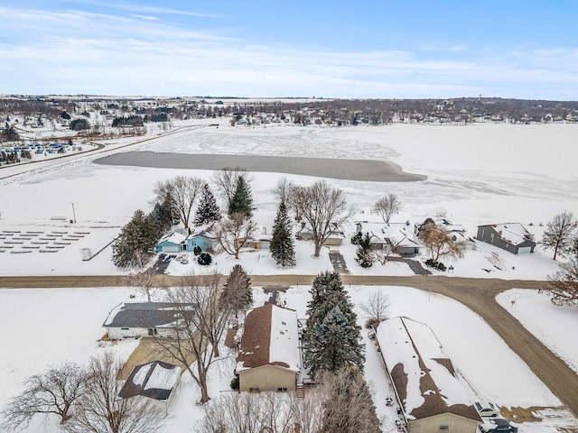 snowy aerial view featuring a residential view