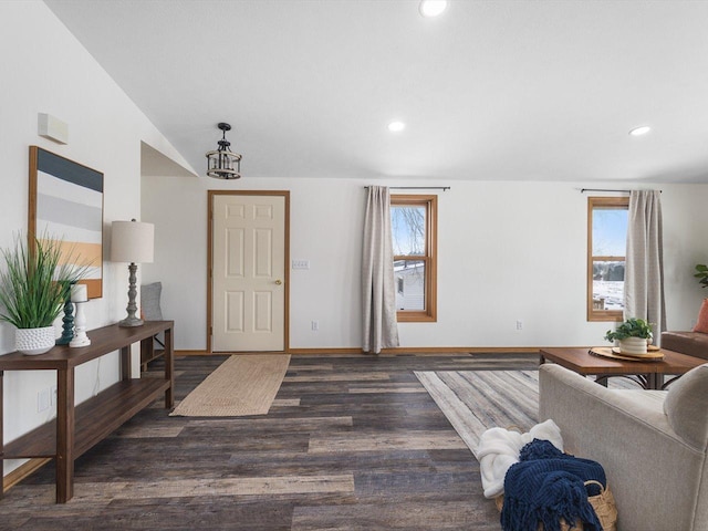 foyer with dark wood-style floors, plenty of natural light, baseboards, and recessed lighting