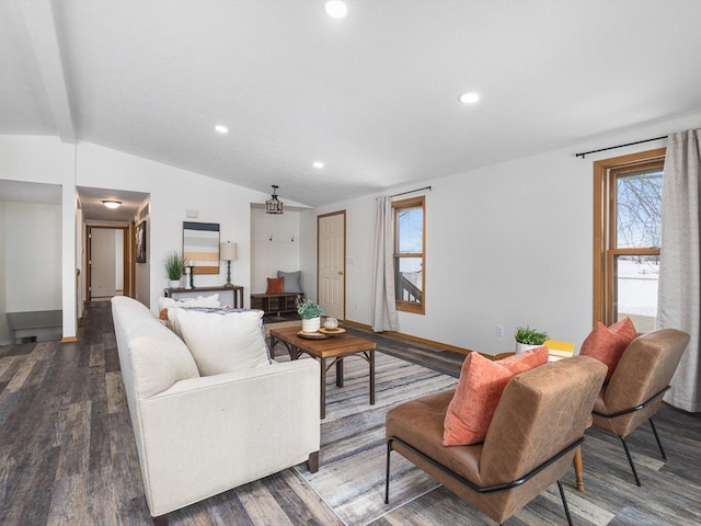 living room featuring dark wood-type flooring, vaulted ceiling, a wealth of natural light, and recessed lighting