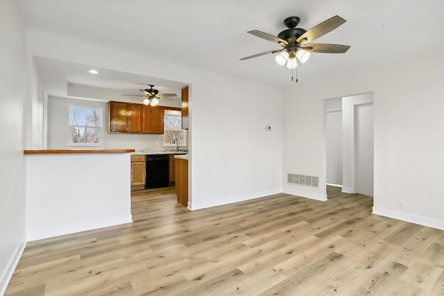 unfurnished living room featuring baseboards, visible vents, a ceiling fan, light wood-type flooring, and recessed lighting