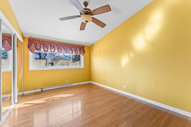 unfurnished room featuring light wood-type flooring, a baseboard radiator, baseboards, and a ceiling fan