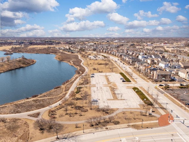 drone / aerial view featuring a water view and a residential view