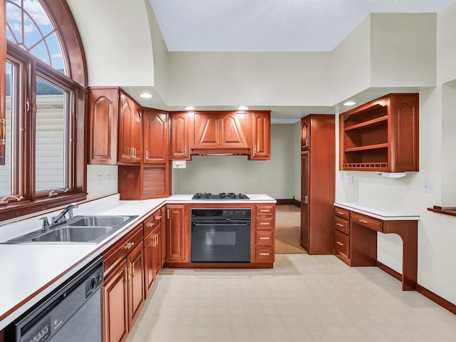 kitchen with built in study area, light countertops, black appliances, open shelves, and a sink