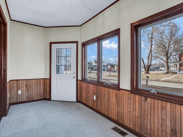 unfurnished sunroom featuring visible vents