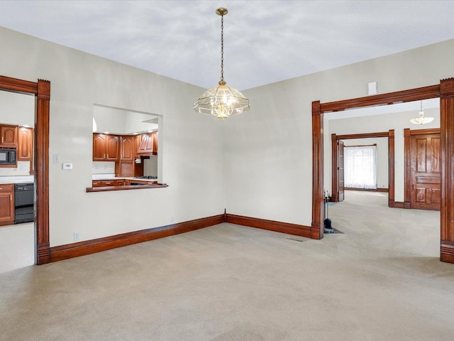 unfurnished room with visible vents, baseboards, and light colored carpet