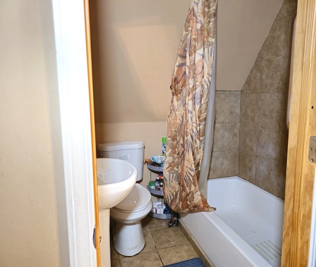 full bathroom with toilet, shower / bathtub combination with curtain, tile patterned flooring, and lofted ceiling