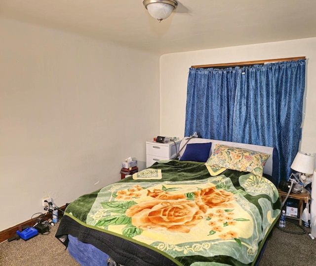 bedroom featuring carpet flooring and baseboards