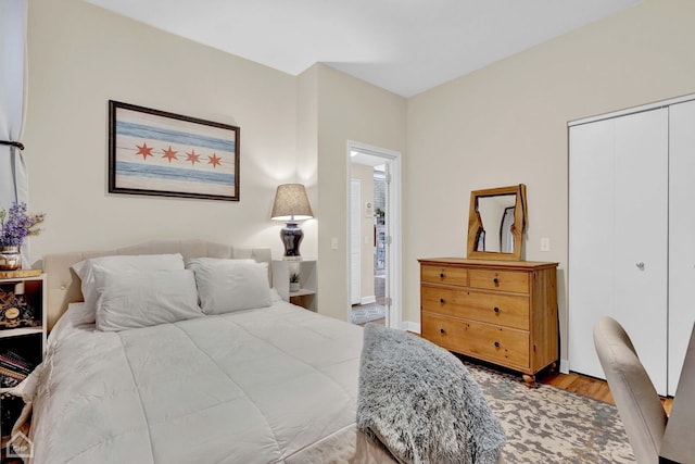 bedroom with a closet and wood finished floors