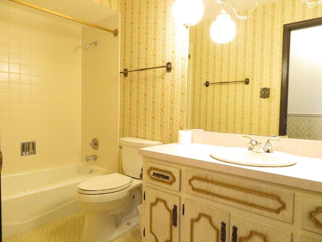 bathroom featuring toilet, vanity,  shower combination, tile patterned flooring, and wallpapered walls