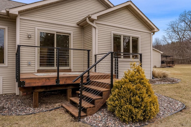 rear view of house featuring a deck