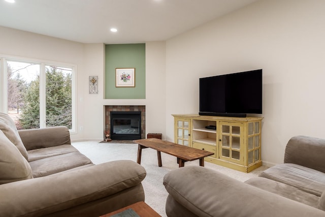 carpeted living room with recessed lighting, baseboards, and a tiled fireplace