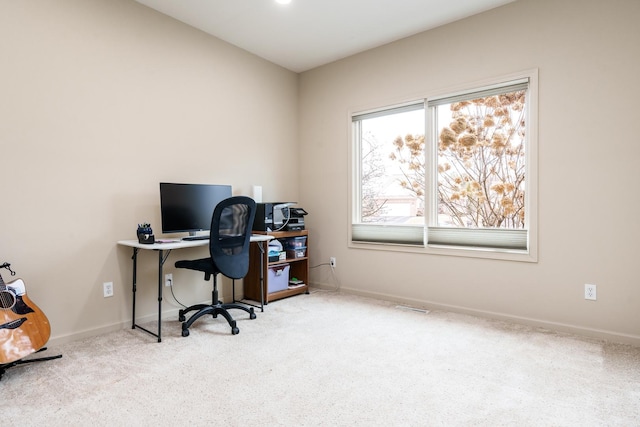 carpeted home office with baseboards and visible vents