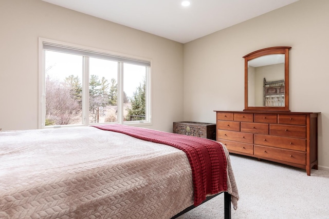 bedroom with light carpet