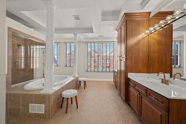 full bath featuring vanity, visible vents, a jetted tub, tile patterned floors, and decorative columns