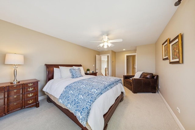 carpeted bedroom featuring ceiling fan and baseboards