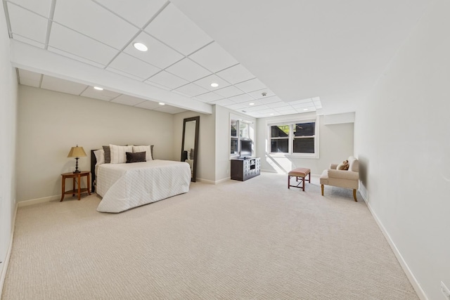 bedroom featuring a drop ceiling, recessed lighting, baseboards, and carpet floors