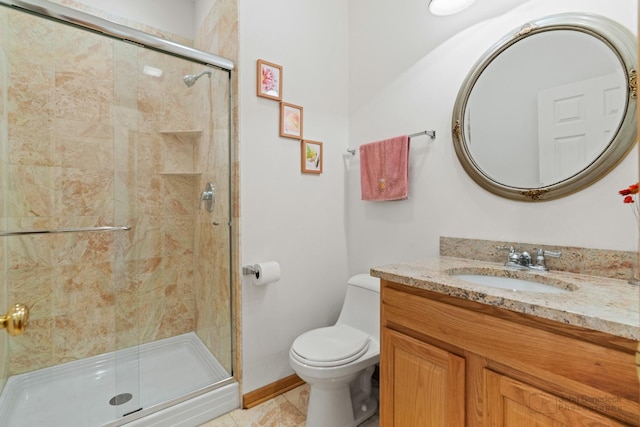 full bathroom featuring a stall shower, vanity, toilet, and tile patterned floors