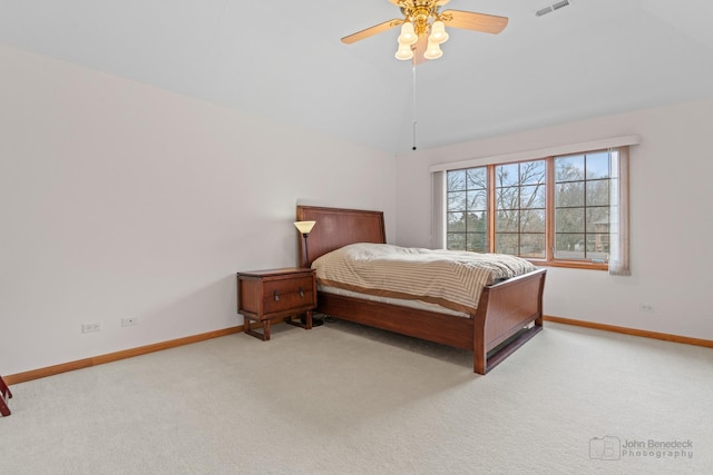 bedroom featuring carpet, visible vents, vaulted ceiling, and baseboards