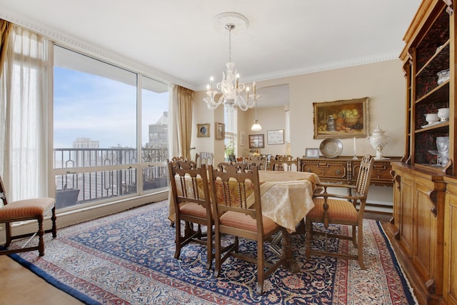 dining area with ornamental molding, a view of city, a notable chandelier, and wood finished floors