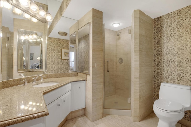 bathroom with toilet, a stall shower, tile patterned flooring, and vanity