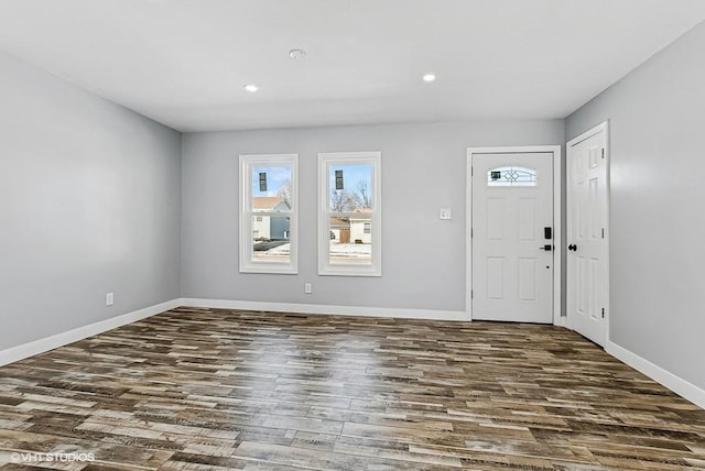 foyer featuring recessed lighting, wood finished floors, and baseboards