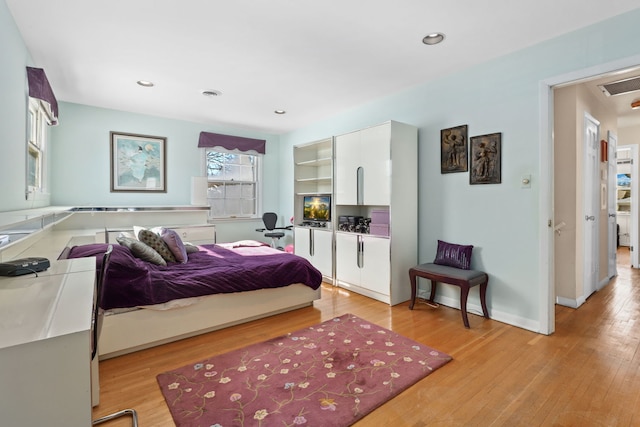 bedroom with recessed lighting, visible vents, and light wood-style flooring