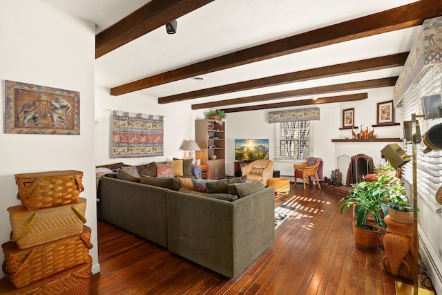 living area featuring a fireplace, dark wood-type flooring, and beamed ceiling