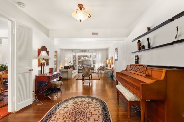 interior space with visible vents and wood finished floors