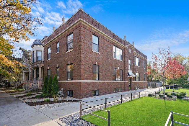 view of building exterior with fence