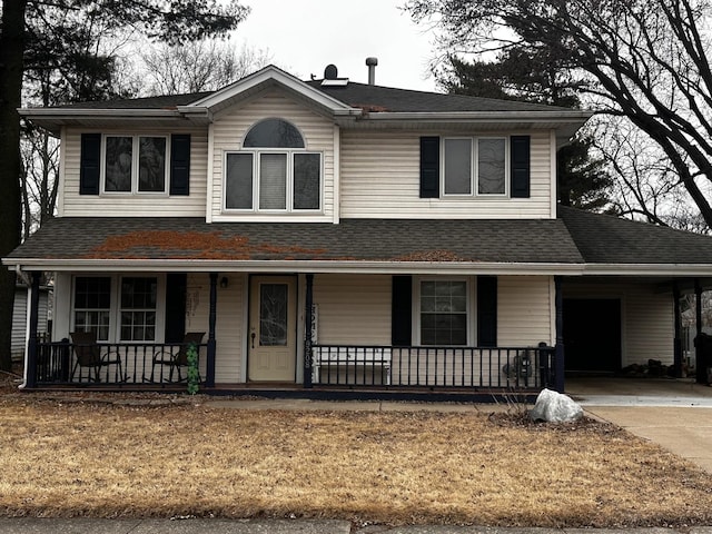 view of front of home featuring a porch, concrete driveway, and roof with shingles