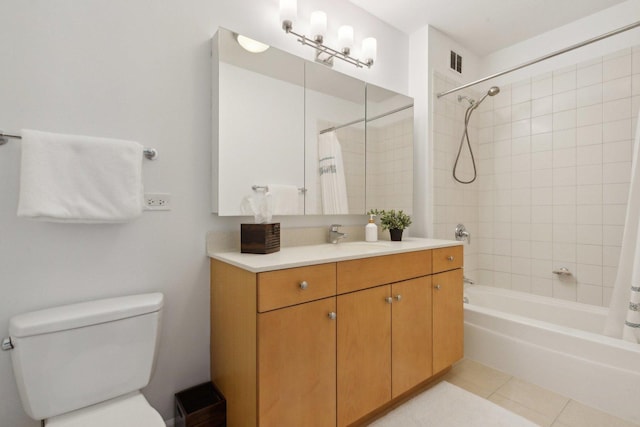 bathroom featuring visible vents, toilet, shower / tub combo, vanity, and tile patterned floors