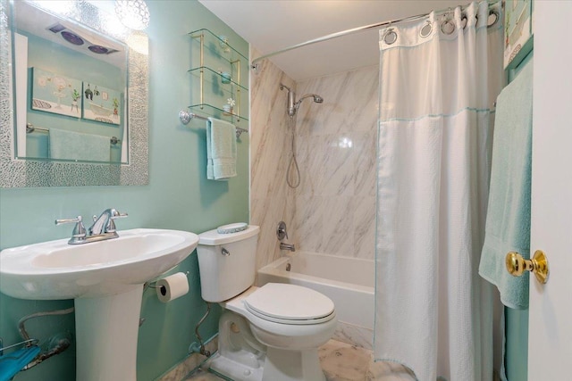 full bathroom with shower / bath combination with curtain, a sink, and toilet