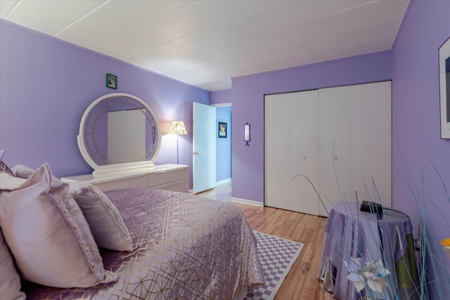 bedroom featuring light wood-style floors and a closet